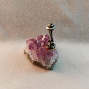 Vintage Pewter Space Needle on an amethyst quartz rock outcropping.